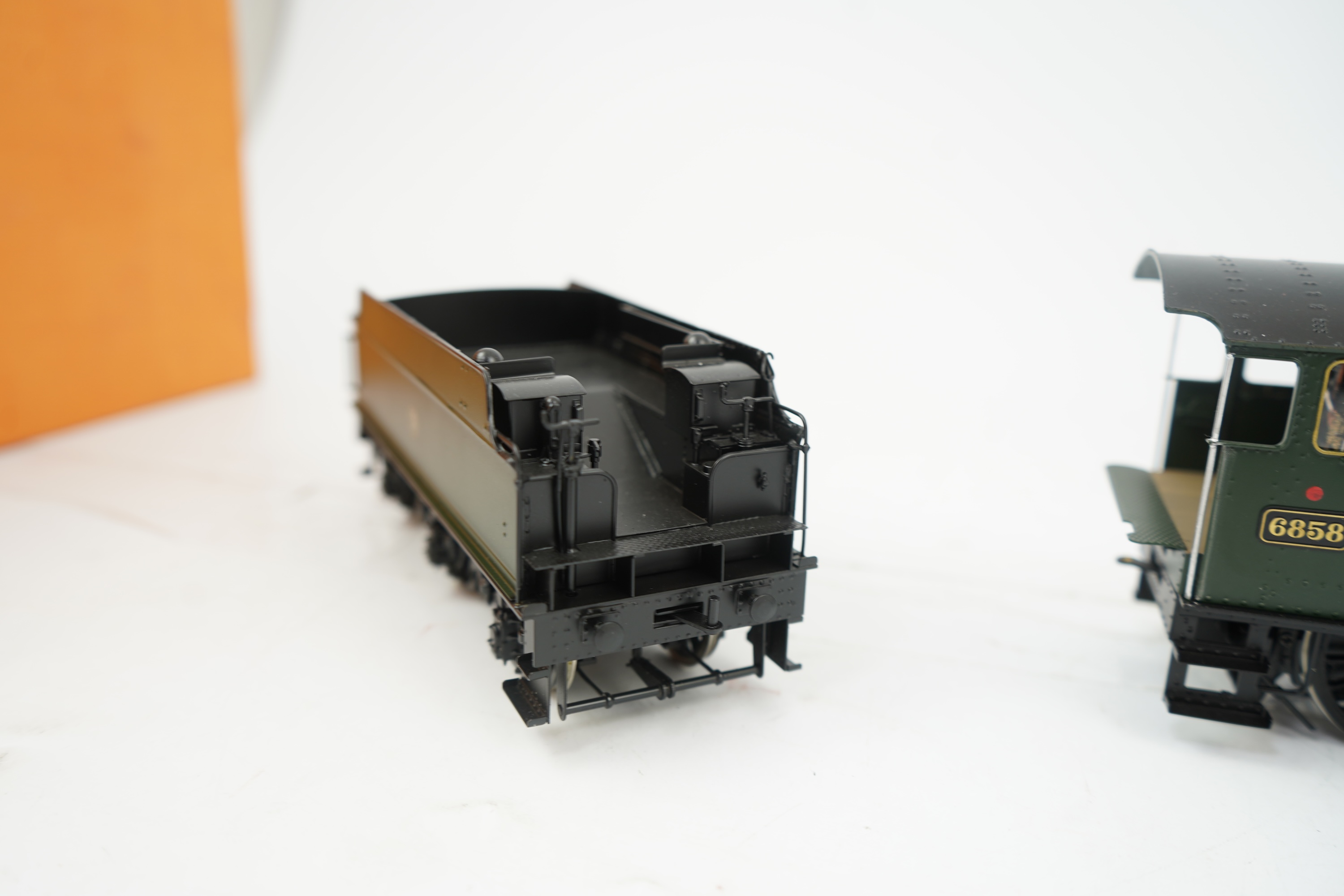 An 0 gauge Finescale Brass (by SanCheng, China) model of GWR Grange Class, Woolston Grange, 6858, 4-6-0 tender locomotive, powered for two rail operation, with original box.